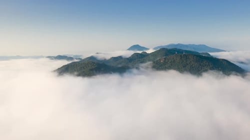Landscape in the morning time during sunrise with fog above the mountain,