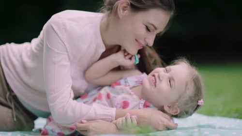 Family In Nature. Mother And Daughter Having Fun At Park