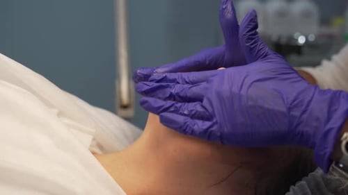 Woman Receives Facial Massage in Spa Close Up