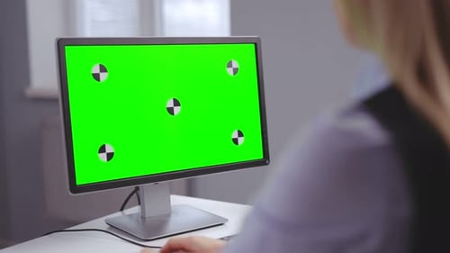 Woman with Green Screen Computer
