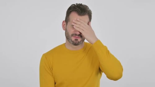 Man Experiencing Headache Against White Background