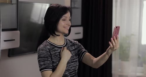 Woman Chatting via Video Call at Home