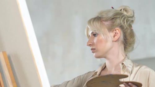Woman Painting on Canvas in Art Studio