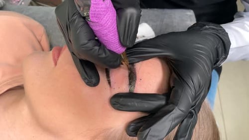 Cosmetic Tattoo Machine Applying Permanent Makeup to Eyebrows