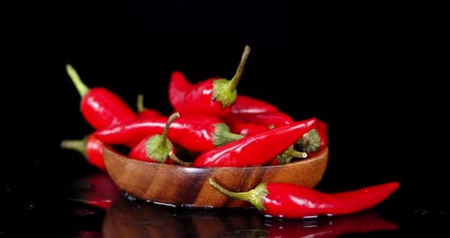 Fresh Red Chili Peppers in Wood Bowl