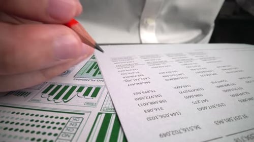 Accountant analyzing business marketing data on paper dashboard at office table.