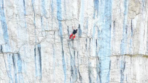 Outdoors rock climbing and active lifestyle concept. Rock climbing on very steep mountain cliff