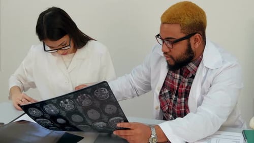 Medical Workers Discussing Brain Computed Tomography X-ray Image