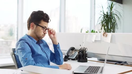Young Handsome Manager Working Hard at Office Having Minute Break Slow Motion