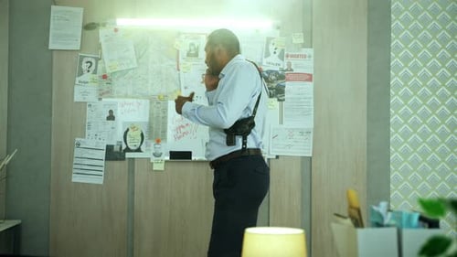 Detective Talking on Phone in Police Office