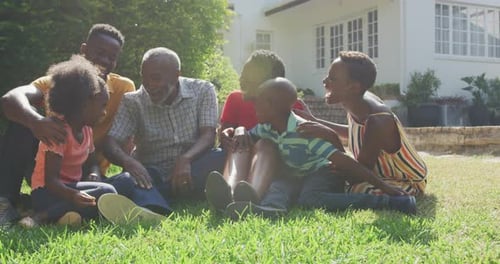 Family Group Laughing Together on Lawn