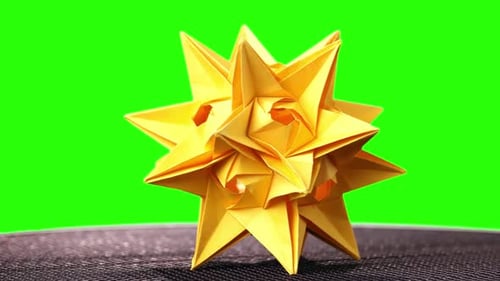 Spiked Origami Figure of Yellow Color.