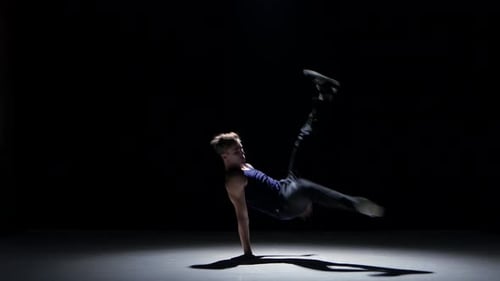 Young Blonde Dancer Man Dancing Breakdance on Black