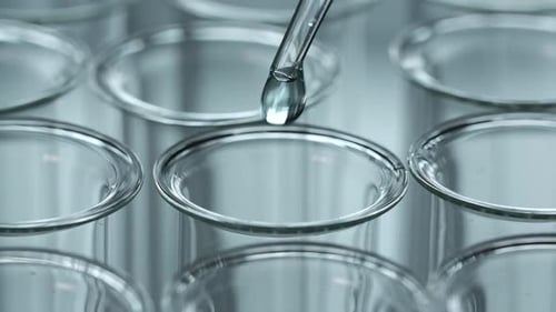 Liquid Dropped into a Scientific Test Tube