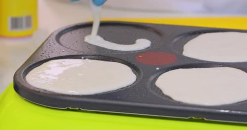 Street Cook Baking a Pancake