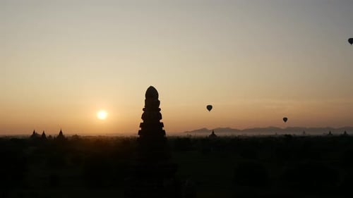 Sunrise over Ancient Temples with Hot Air Balloons