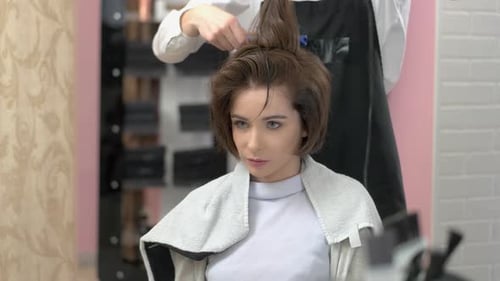 Woman Getting a Haircut at Beauty Salon