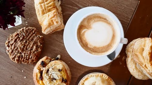 Breakfast with Croissants Pie Cookie and Cup of Coffee on Wooden Table in Cafe