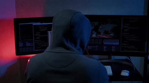Unrecognizable Hacker Man Typing on Keyboard and Engaging Hacking Into Security Systems