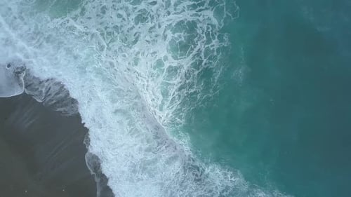 Aerial Top Down View of Turquoise Sea Waves Foaming and Splashing, Big Waves From Above Rolling