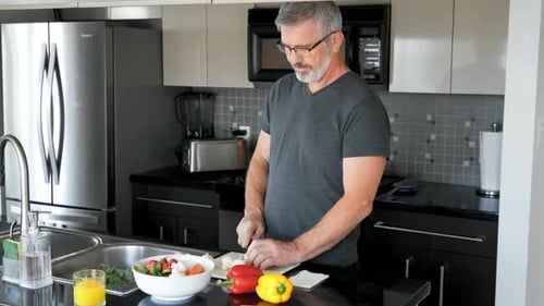 Man Cooking Vegetables in Modern Kitchen