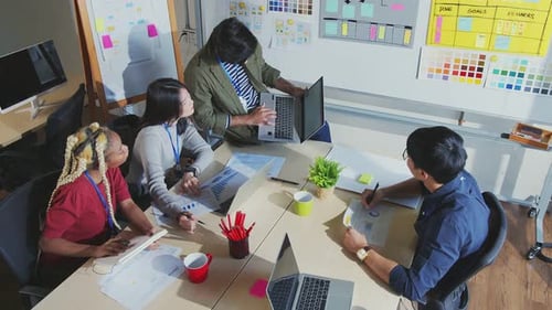 Diverse Team Collaborating in a Modern Office