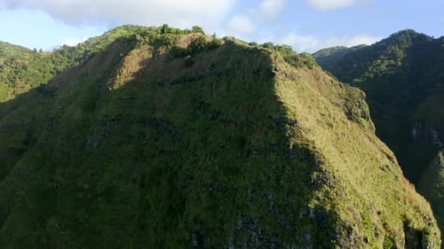Beautiful Aerial Footage of the Grassy Top of the Mountain Under the Bright Sun