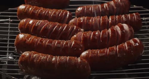 Sizzling Sausages on a Grill, Close Up