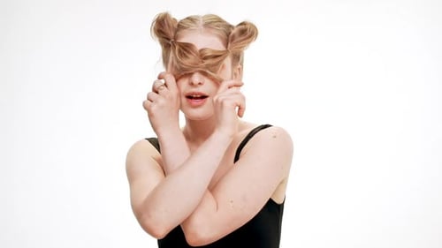 Smiling Woman with Blonde Pigtails Posing