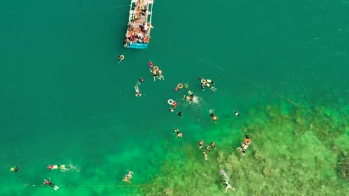 Tourists Snorkeling in the Lagoon, Philippines, El Nido.
