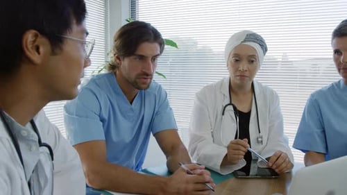 Diverse Medical Professionals Meeting in Office