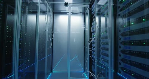 An Empty Corridor with Cables in a Data Center