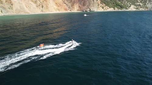 Jet Ski Pulling Tube on the Ocean