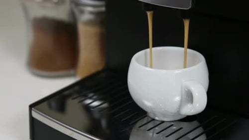Coffee Machine Fills White Cup with Hot Coffee