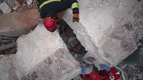 Rescuers Search Collapsed Building from Above