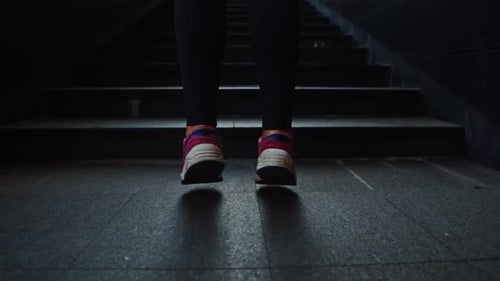 Close Up Shot of Cute Girl Legs Jumping in Red Sneakers to Both Sides