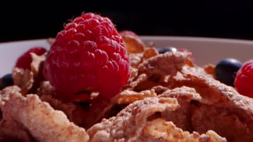 Pass Over a Bowl of Cereal with Raspberries and Blueberries