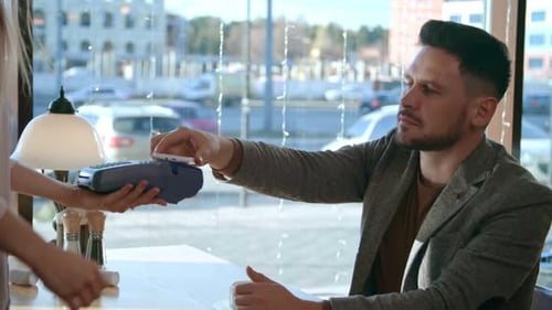 Man Pays Via Phone at Restaurant