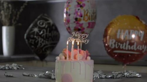 Celebration Birthday Cake with Balloons and Candles