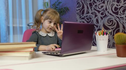 Child Counts During Online Lesson on Computer
