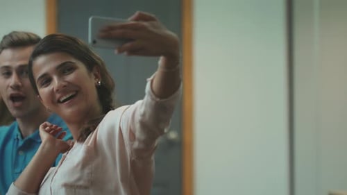 Three Friends Taking a Selfie in the Workplace