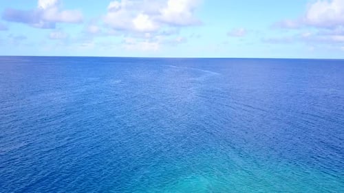 Aerial drone sky of marine shore beach trip by blue ocean and sand background