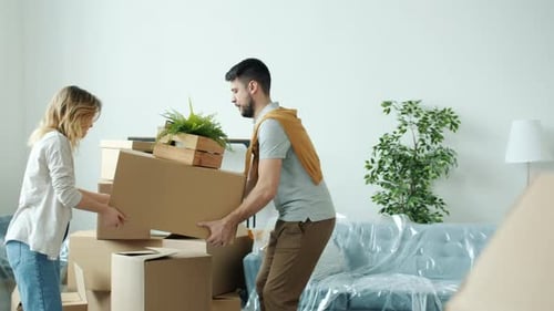 Couple Moves into New Home with Boxes