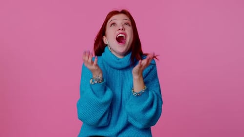 Shocked Woman Expressing Surprise in Teal Sweater