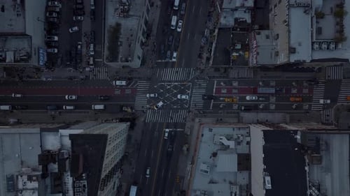 Aerial Birds Eye Overhead Top Down Ascending Footage of Vehicles Passing Through Road Intersection