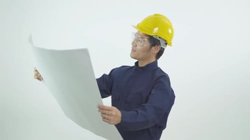 Portrait of young Asian engineer man worker with safety uniform helmet and protective clear glasses