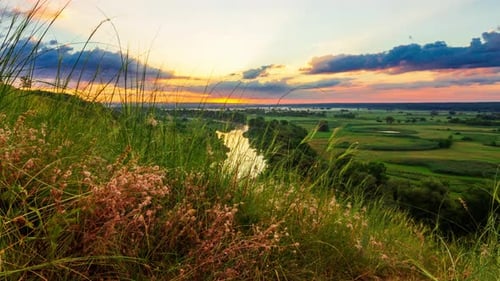 Scenic Sunrise Time-Lapse over Rural River Landscape