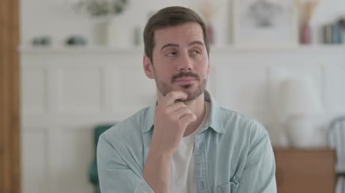 Portrait of Thinking Young Man Getting New Idea