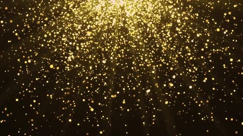 Super slow motion Abstract glittering golden particles Light on black.