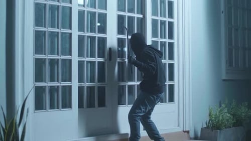 Burglar Trying to Break Into a Home at Night